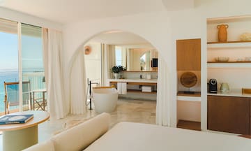 a bathroom with a tub and a bathtub