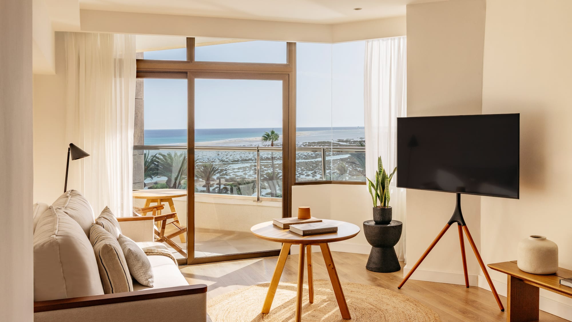 a living room with a television and a table
