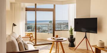 a living room with a television and a table