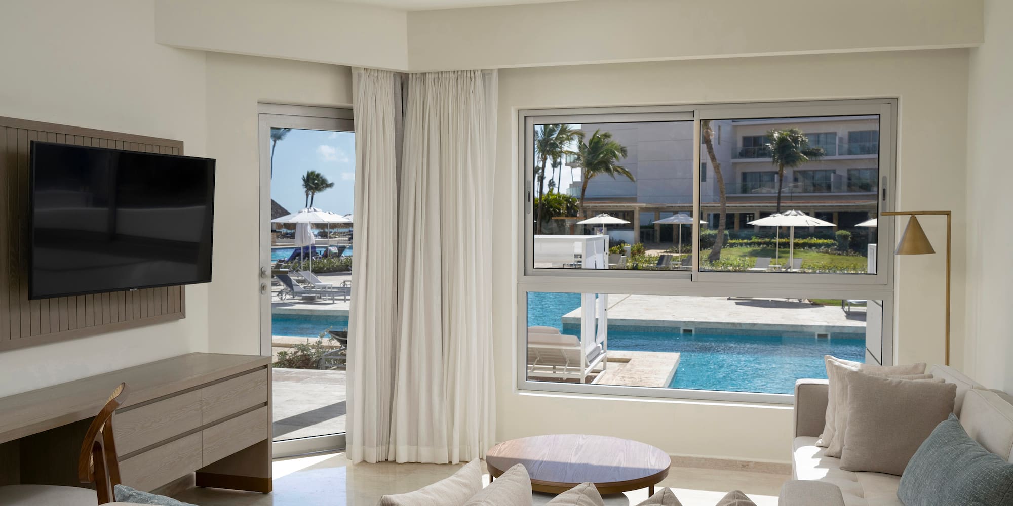 a living room with a television and a pool