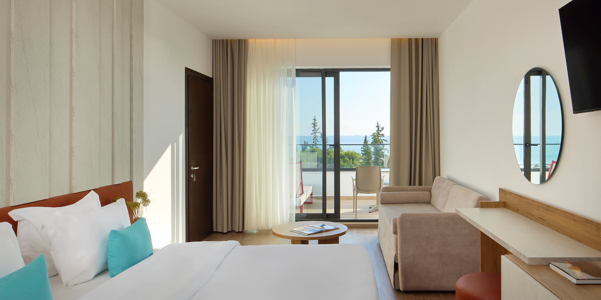 a room with a bed and couches