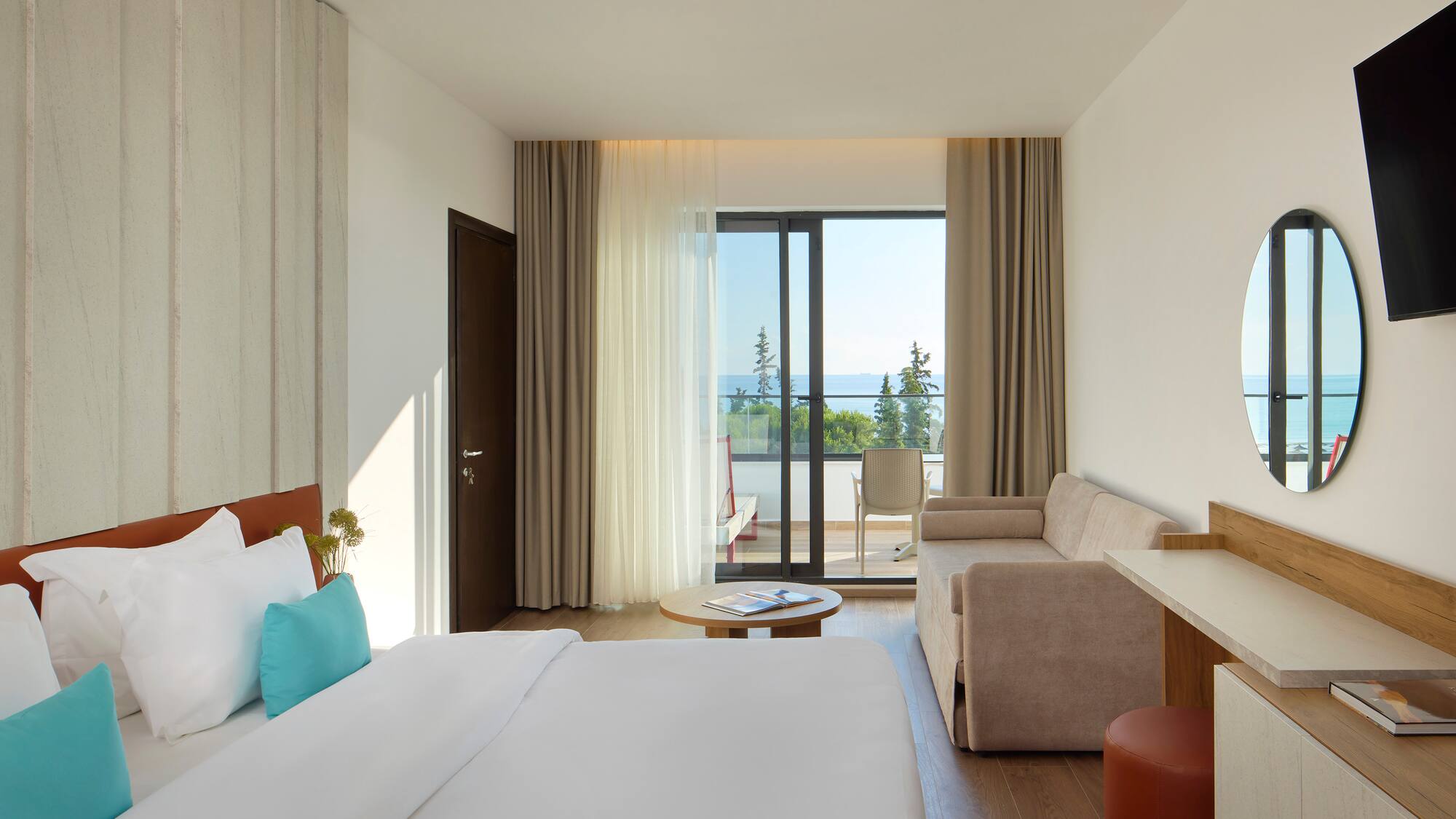 a room with a bed and couches