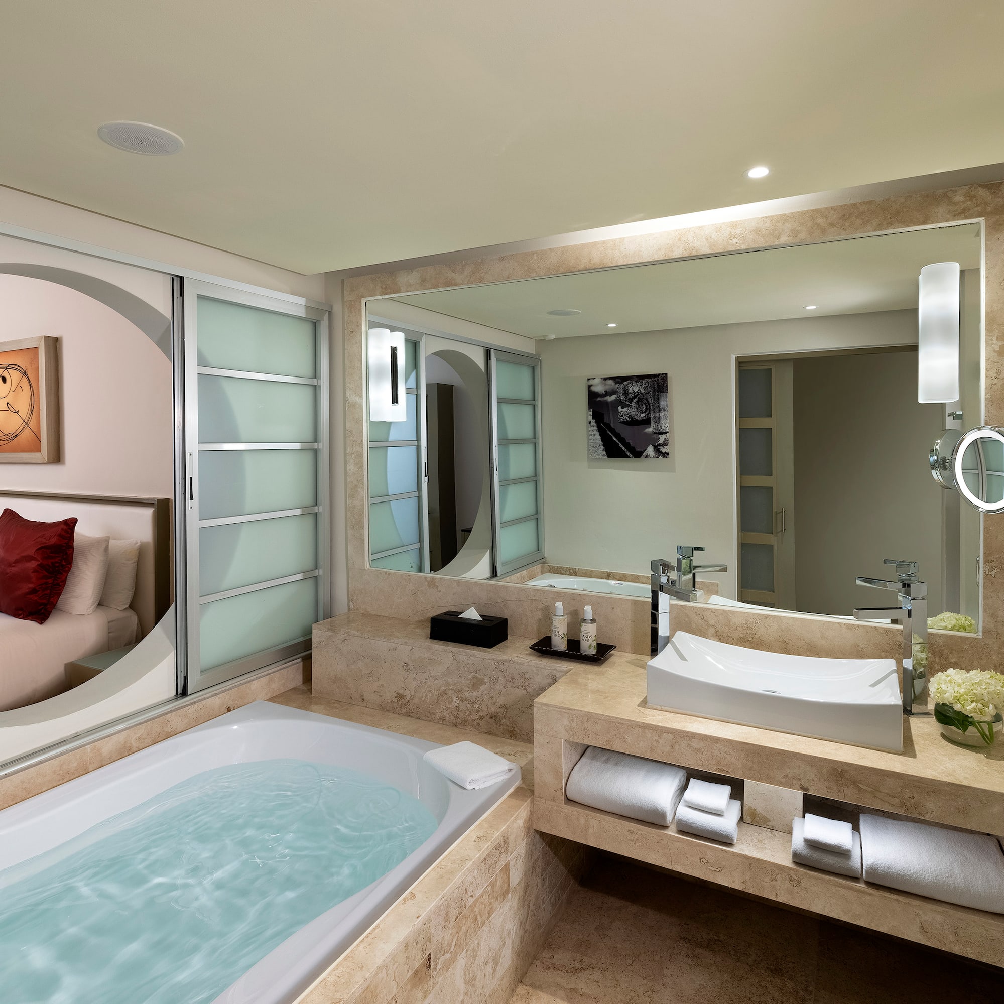 a bathroom with a bathtub and a mirror