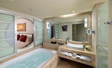 a bathroom with a bathtub and a mirror