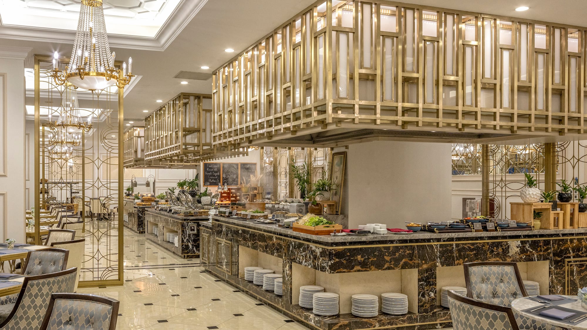 a restaurant with a large counter and a chandelier
