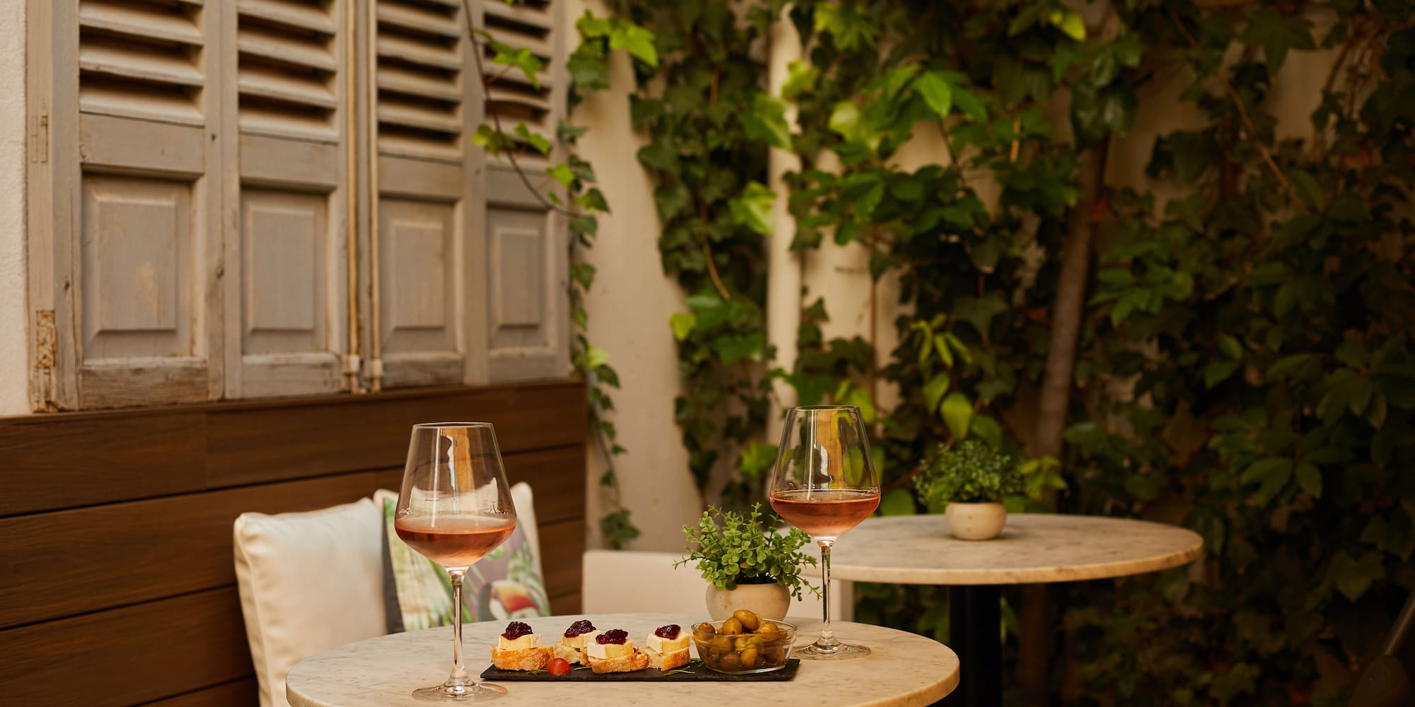 a table with food and wine glasses on it