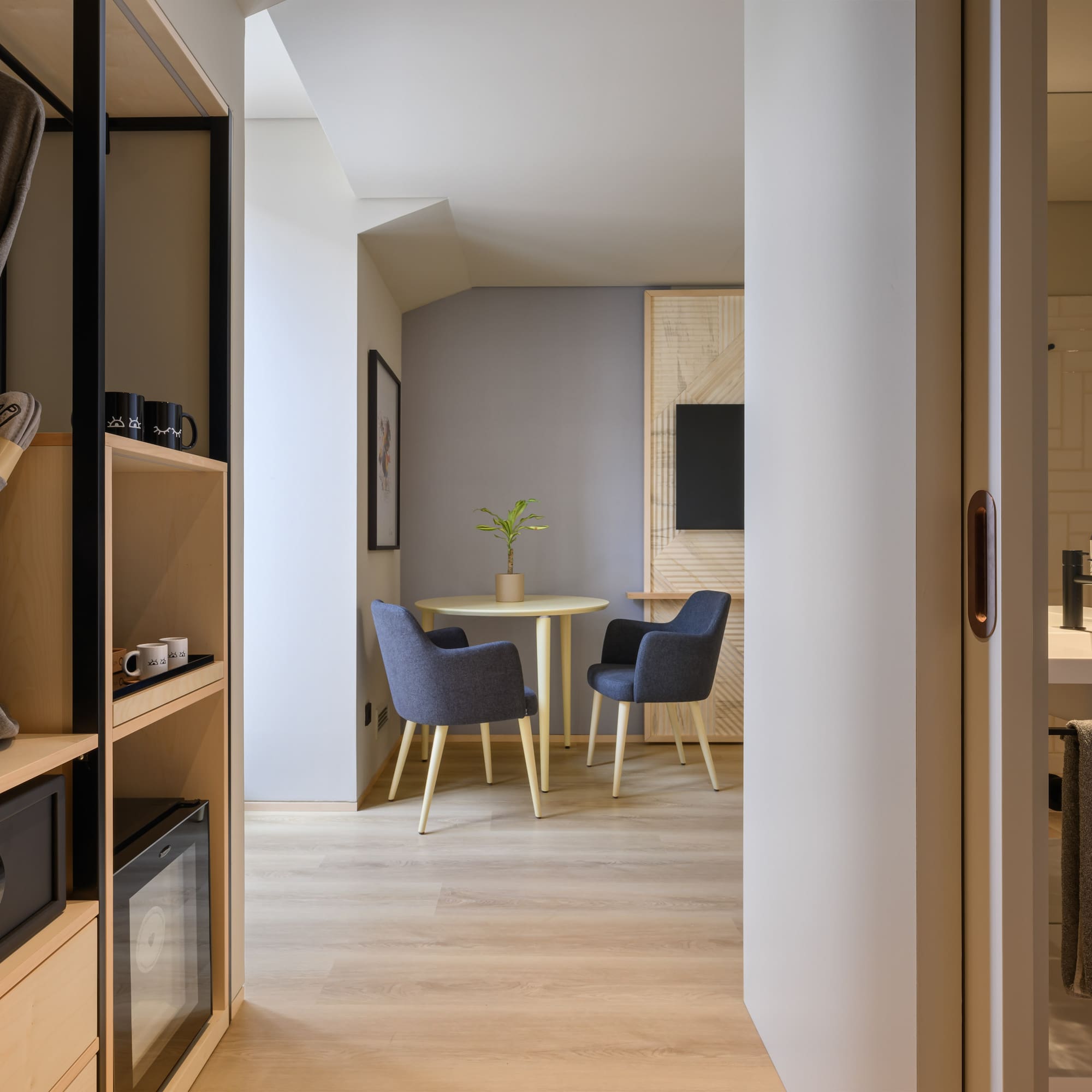 a room with a table and chairs