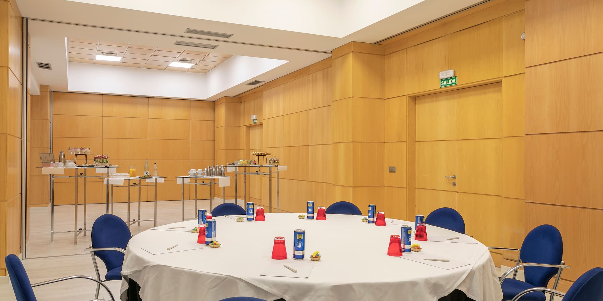 a room with a round table and chairs