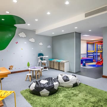 a room with a playroom and a playroom with a playroom and a playroom with a playroom and a playroom with a playroom and a playroom with a playroom and