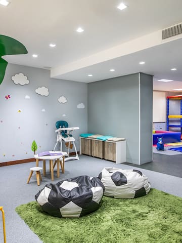 a room with a playroom and a playroom with a playroom and a playroom with a playroom and a playroom with a playroom and a playroom with a playroom and