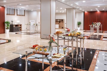 a room with a glass table with food on it