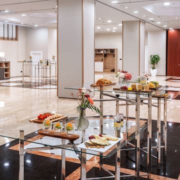 a room with a glass table with food on it