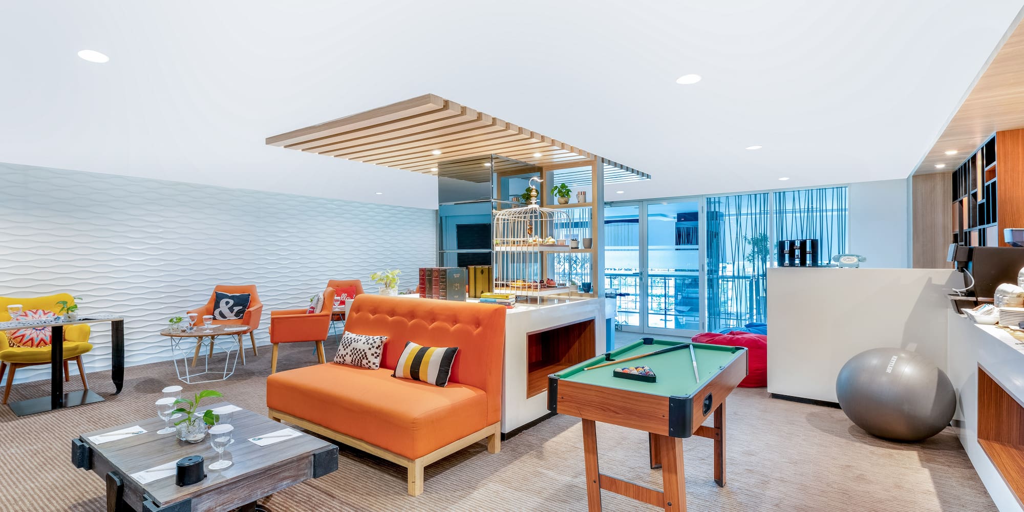 a room with a pool table and couch