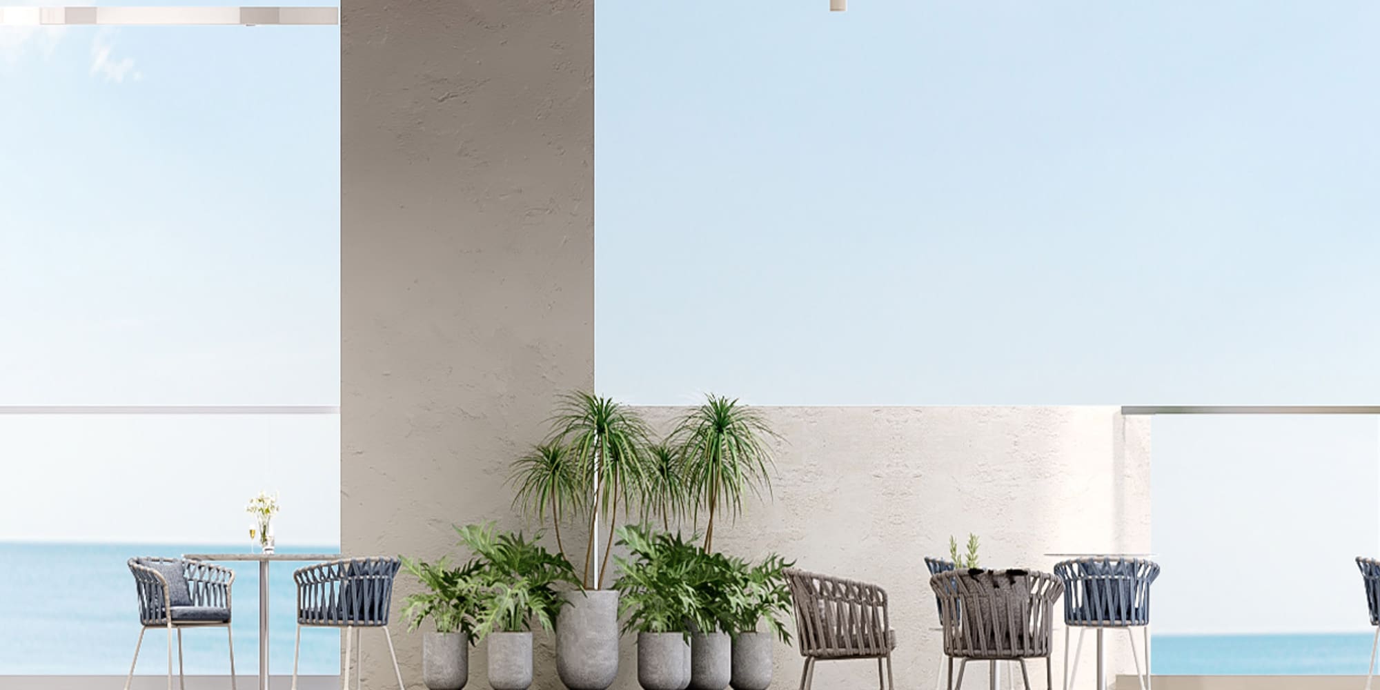 a patio with chairs and tables and plants
