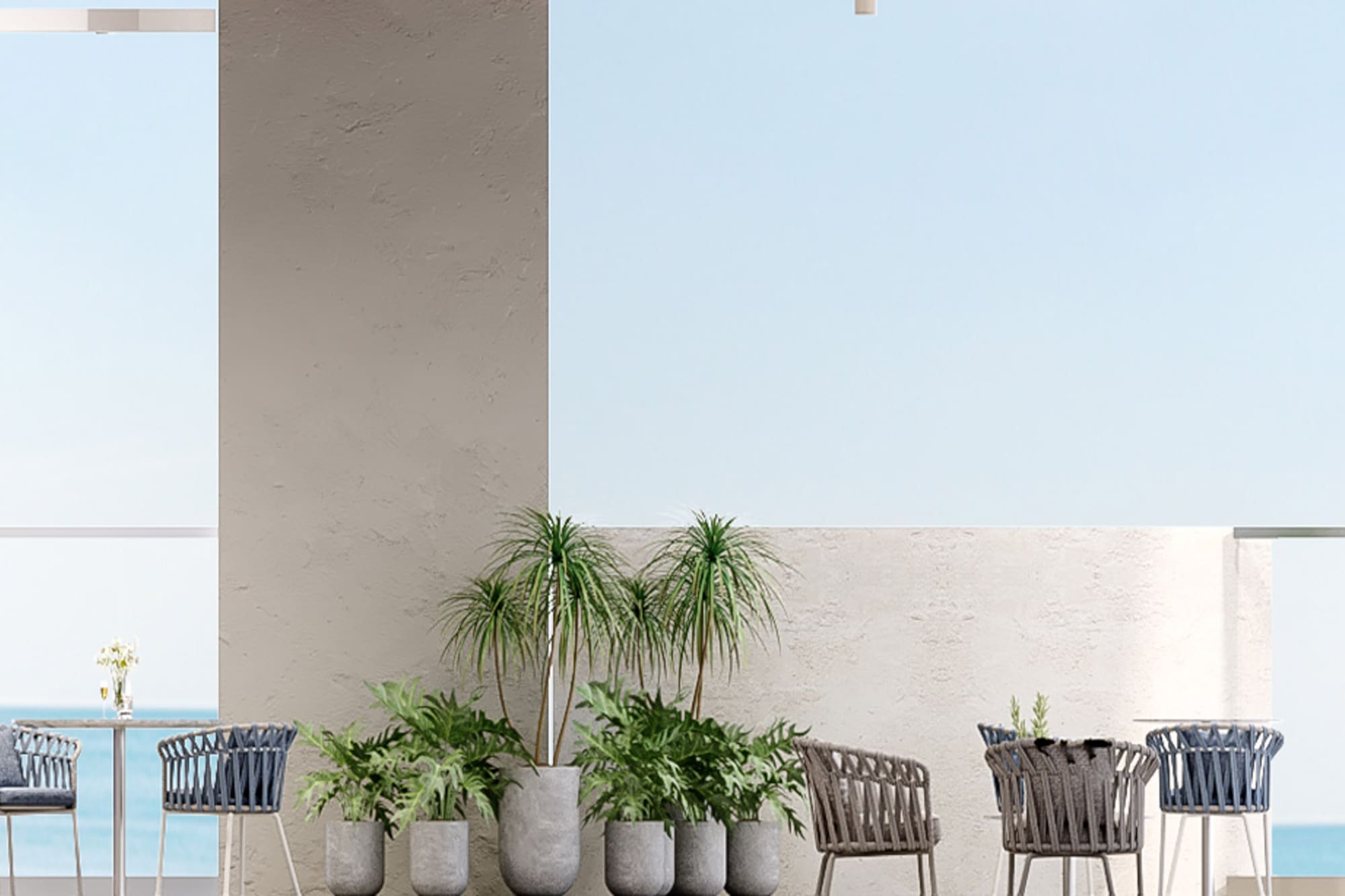a patio with chairs and tables and plants