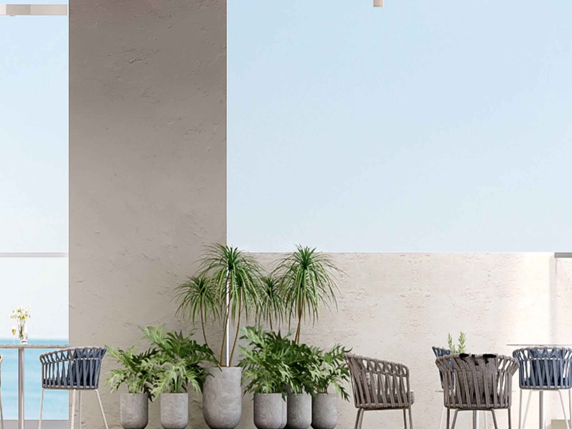 a patio with chairs and tables and plants