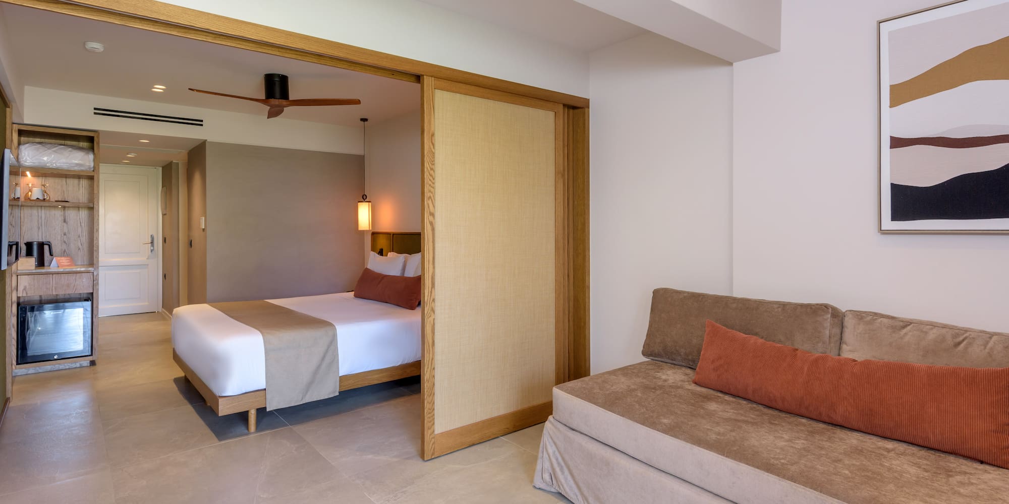 a room with a bed and a folding door