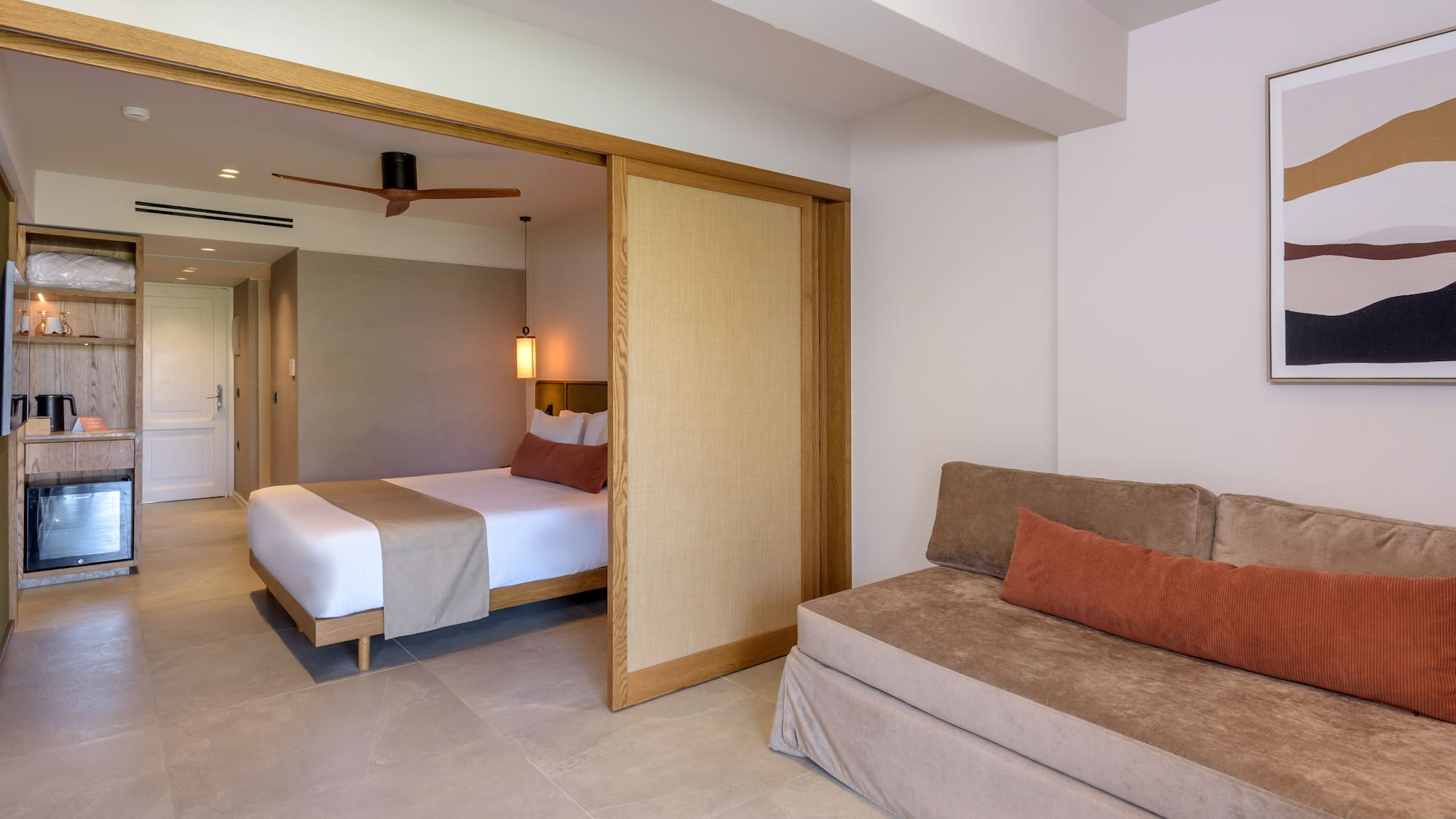 a room with a bed and a folding door