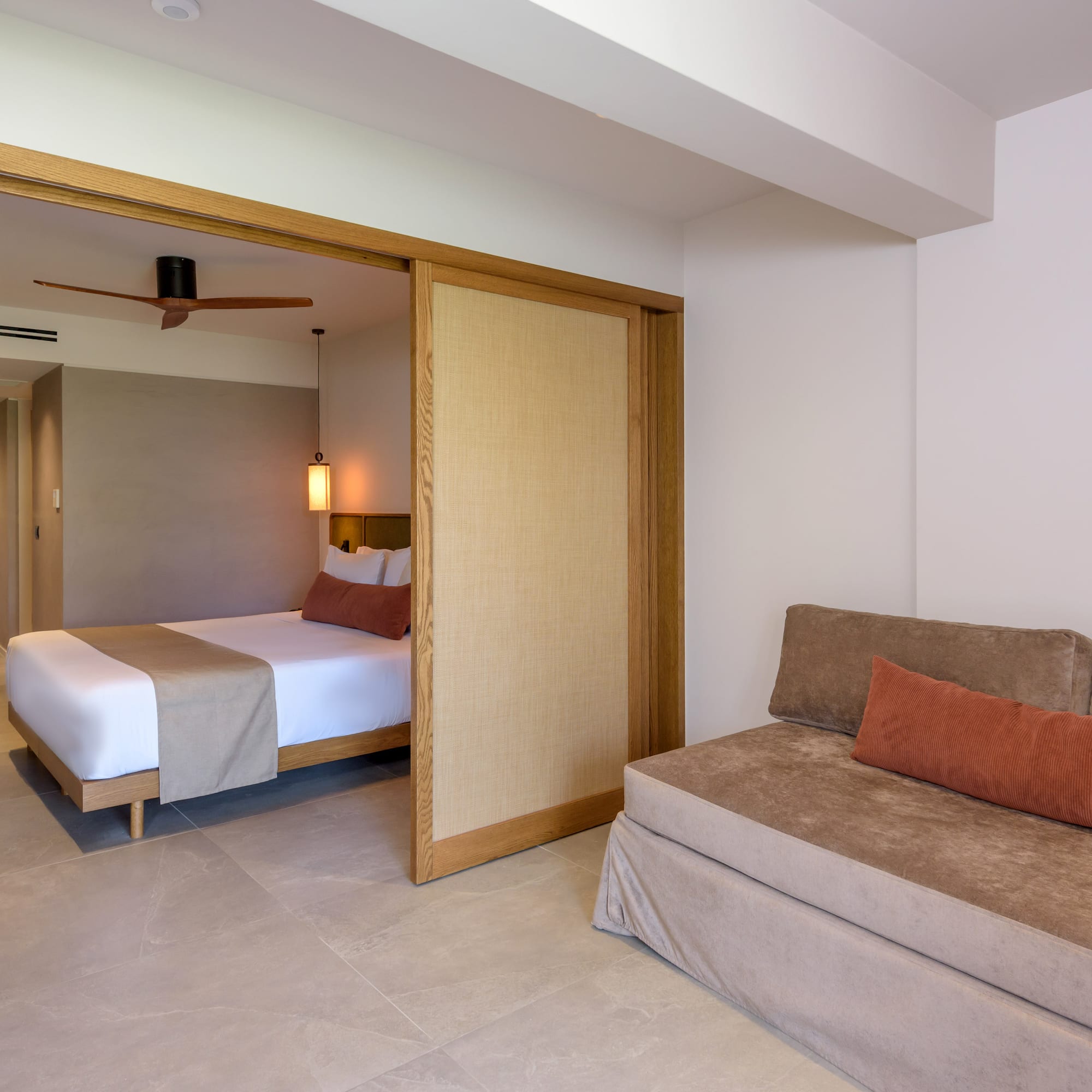 a room with a bed and a folding door