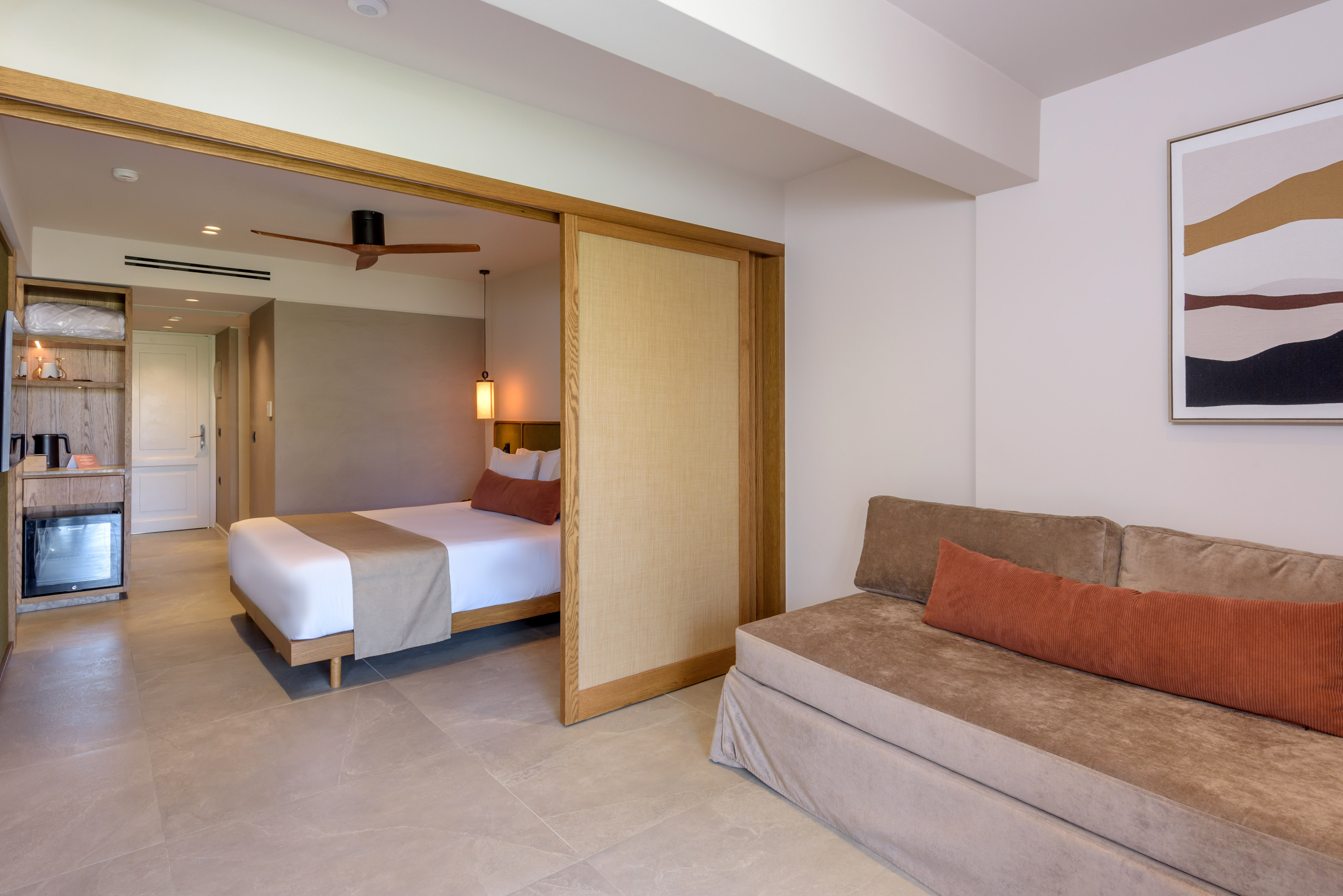 a room with a bed and a folding door