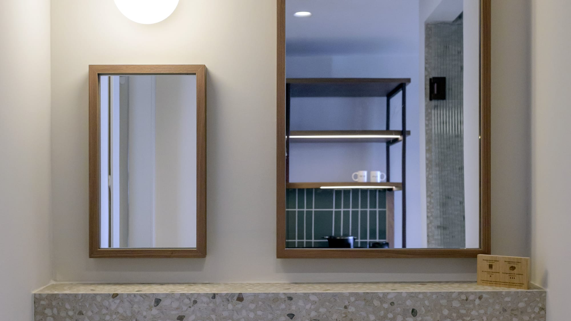 a mirror above a sink