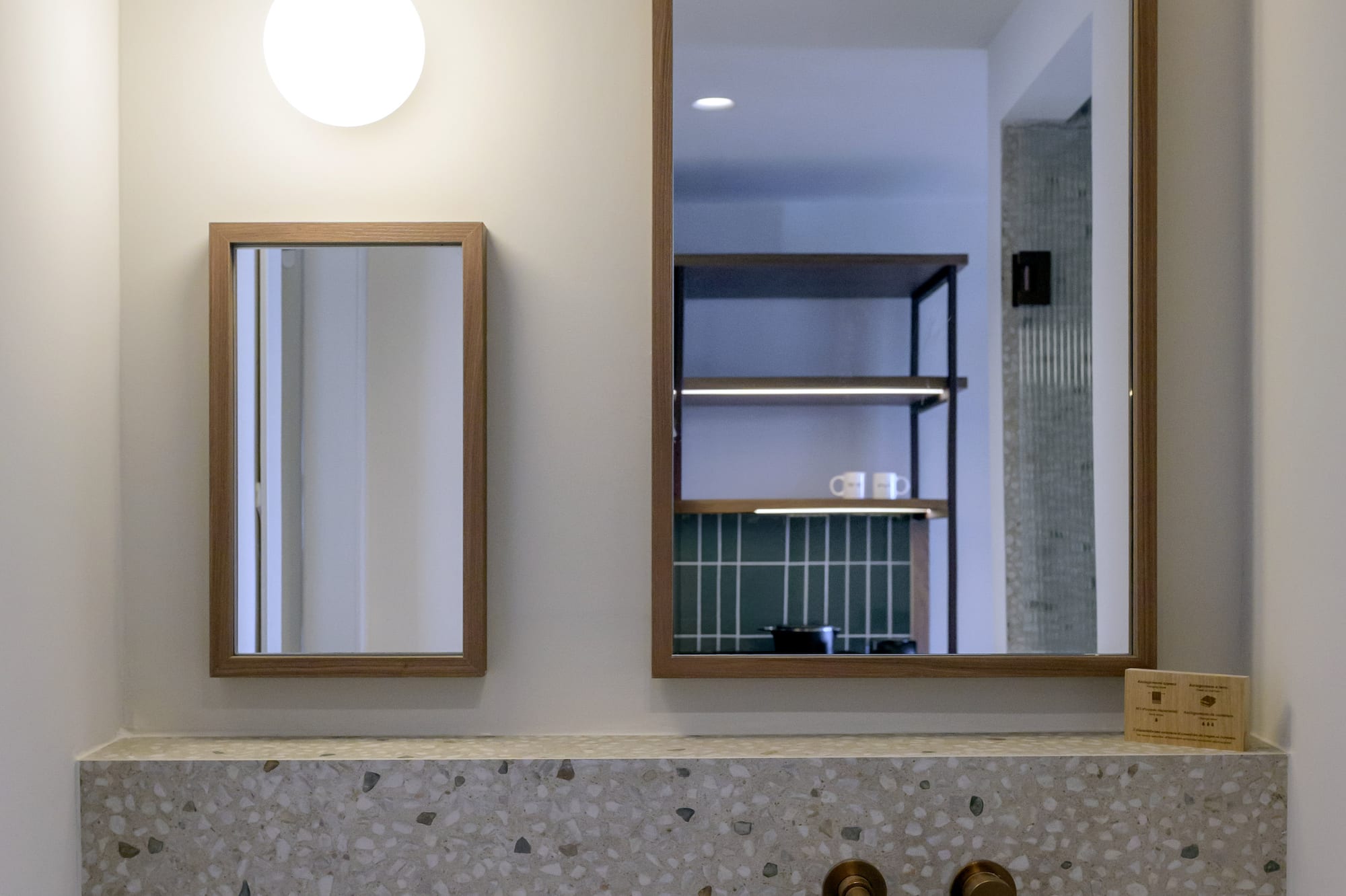 a mirror above a sink