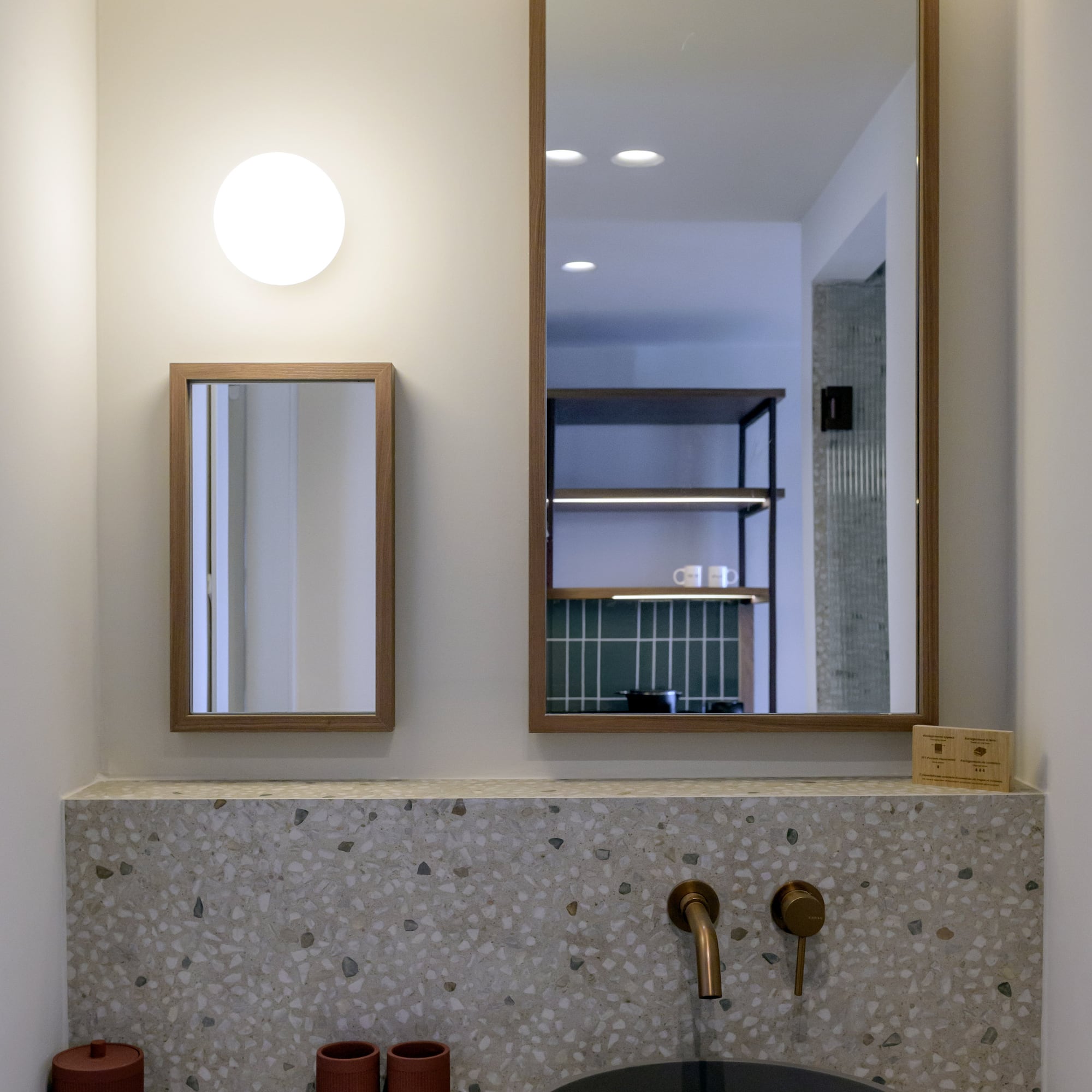 a mirror above a sink