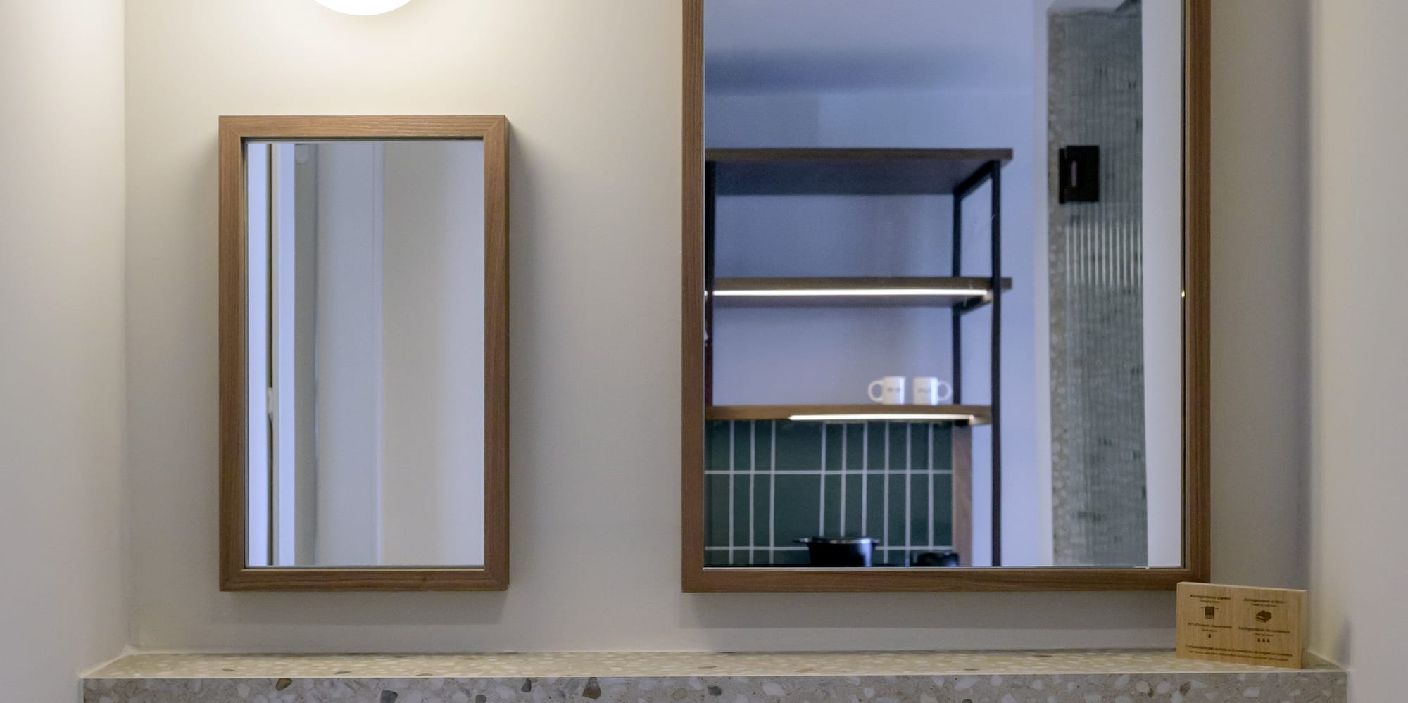 a mirror above a sink