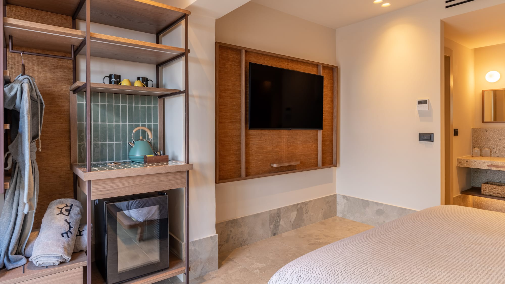 a room with a tv and a shelf