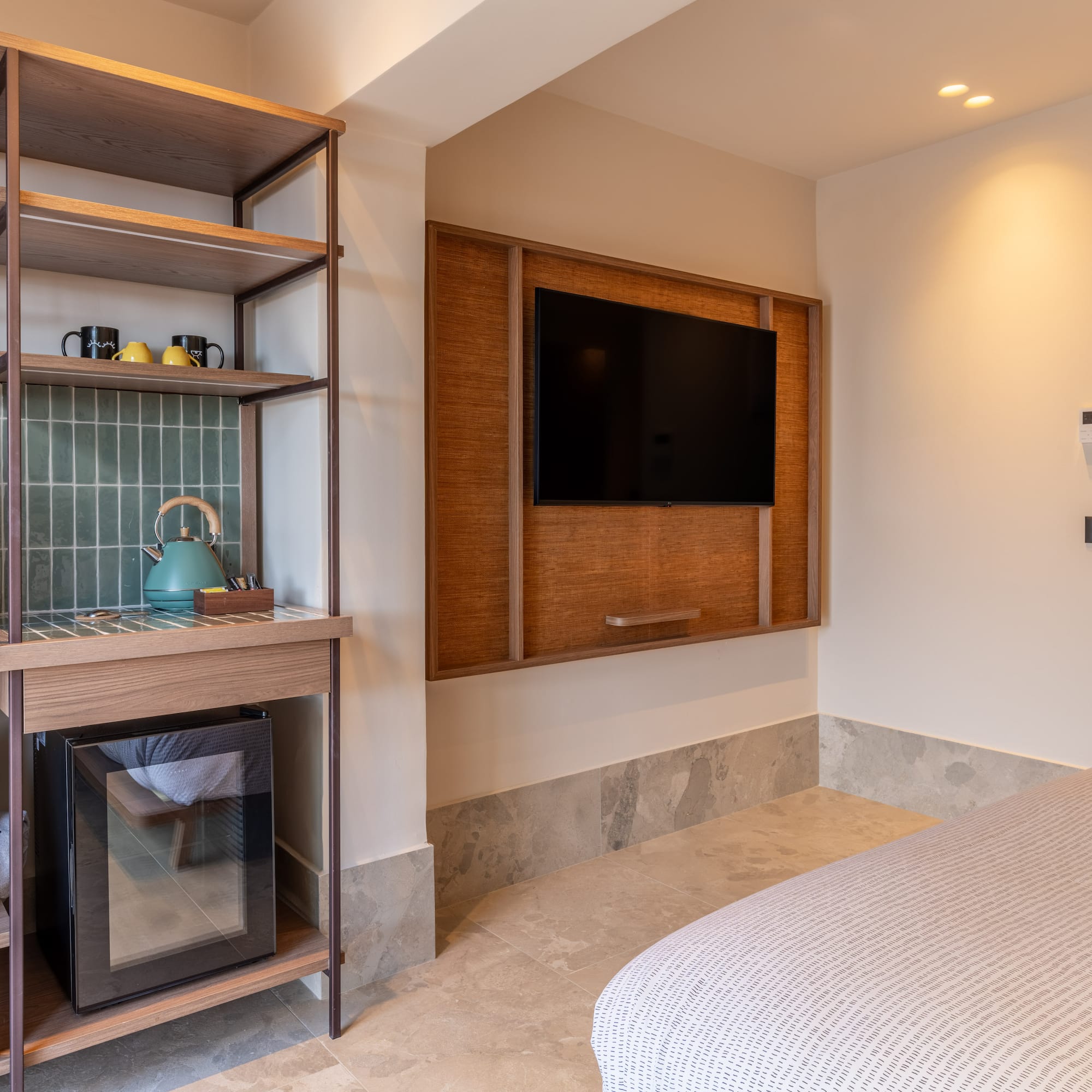 a room with a tv and a shelf