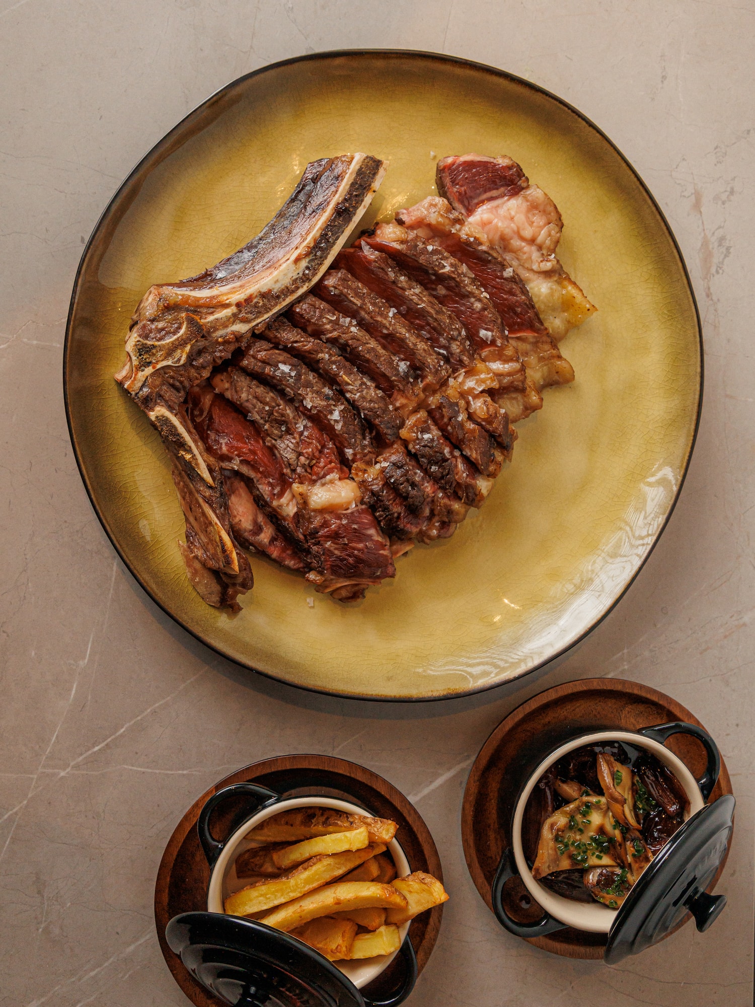 a plate of meat and french fries