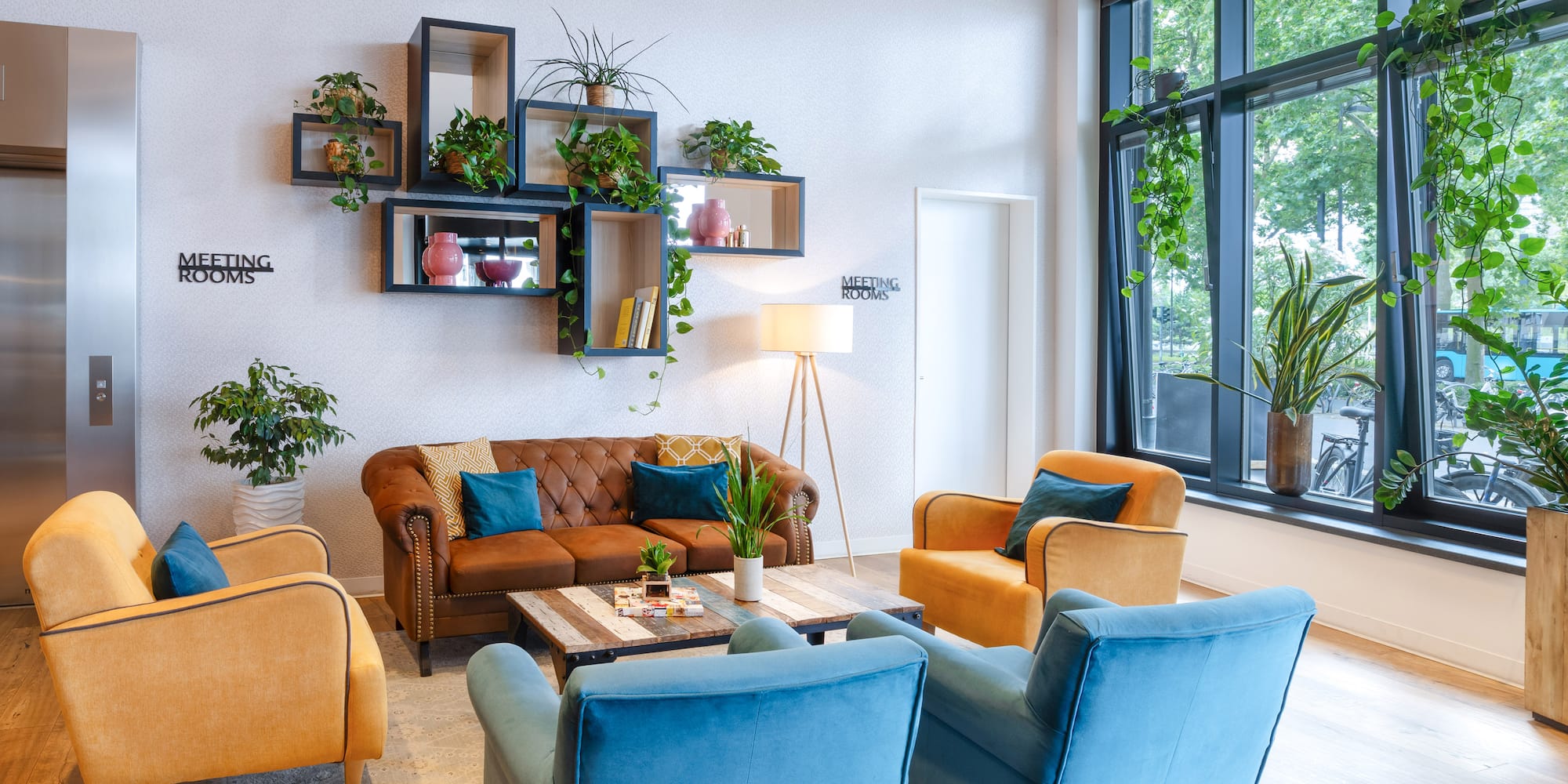 a room with a couch and chairs