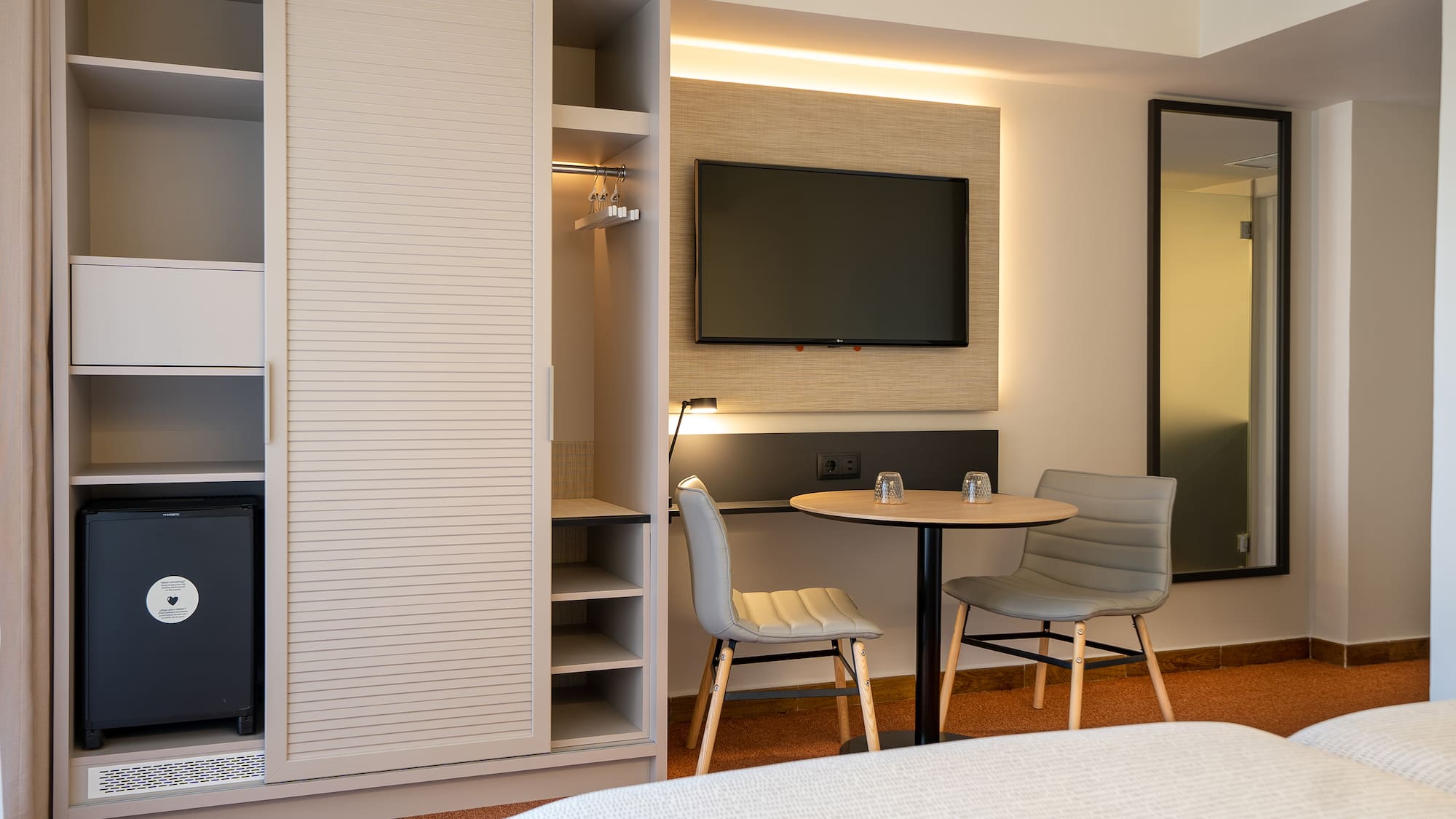 a room with a tv and a table