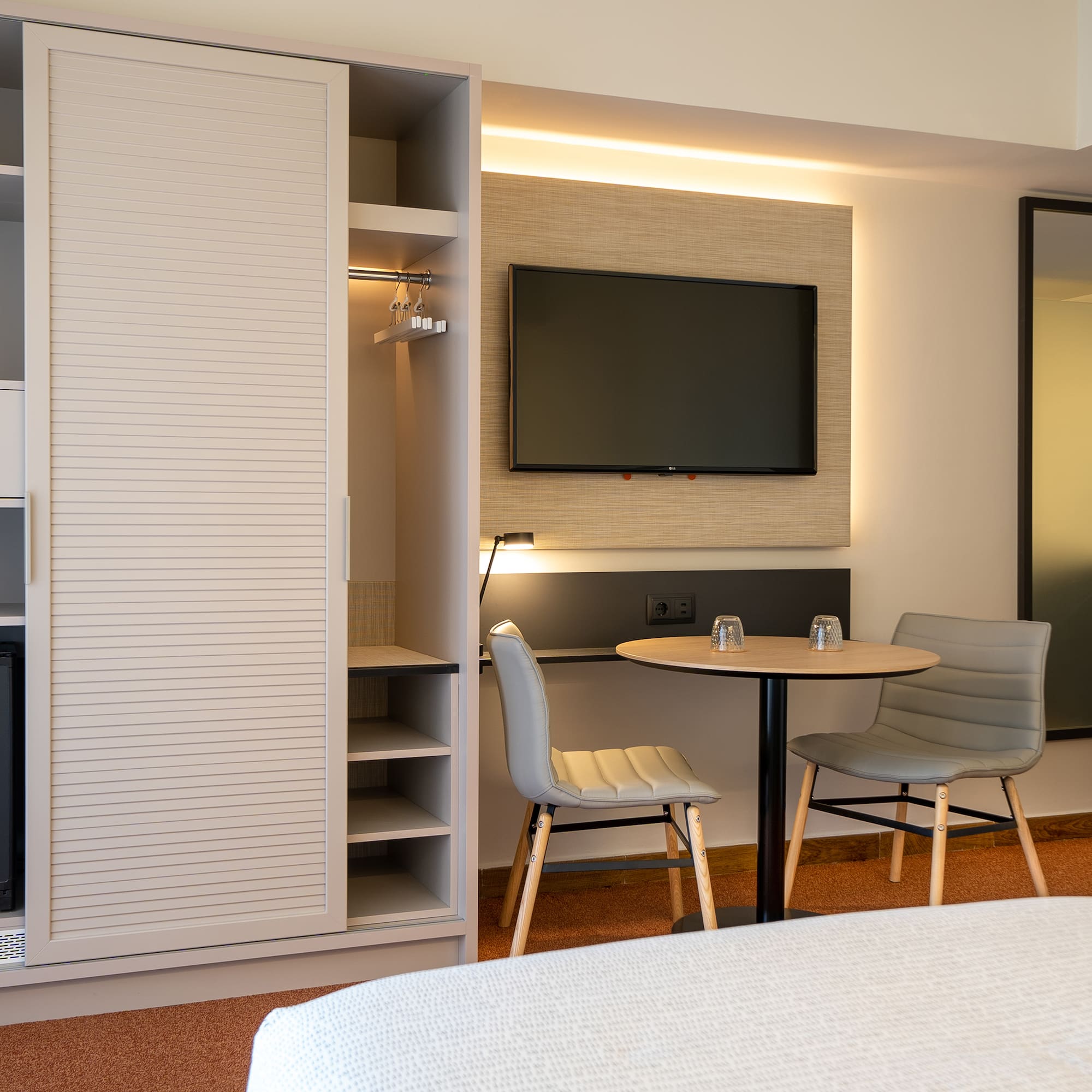 a room with a tv and a table