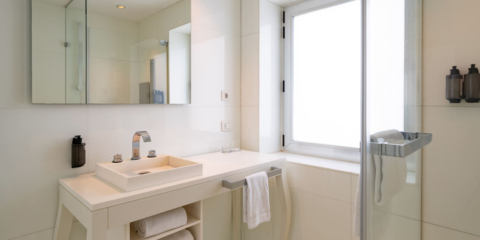 a bathroom with a sink and a shower