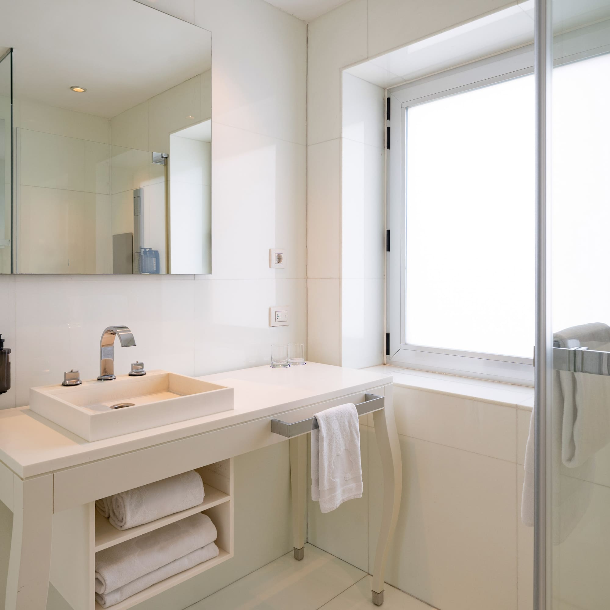a bathroom with a sink and a shower