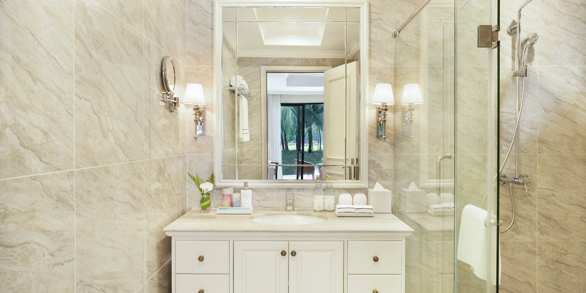 a bathroom with a mirror and a shower