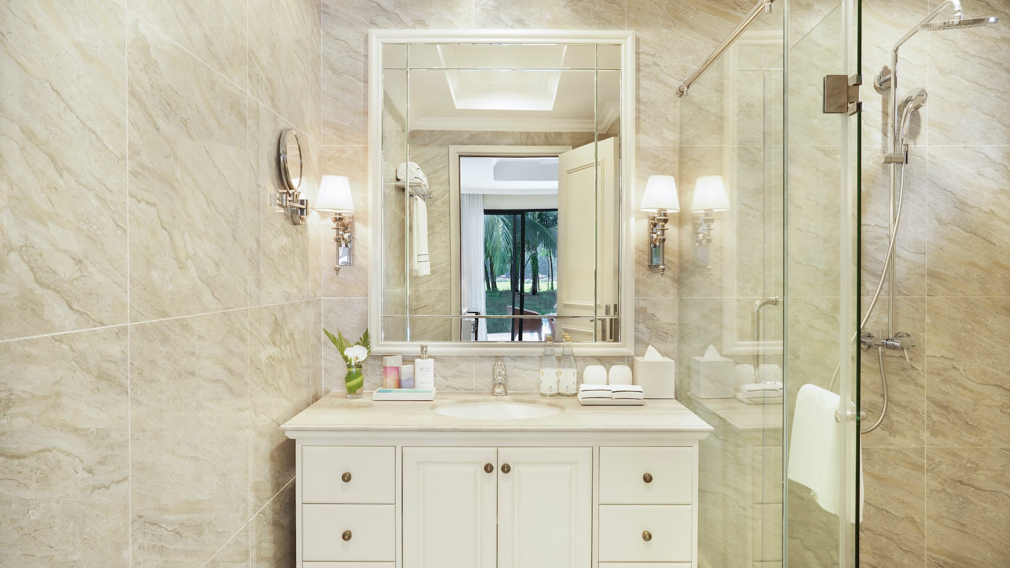 a bathroom with a mirror and a shower