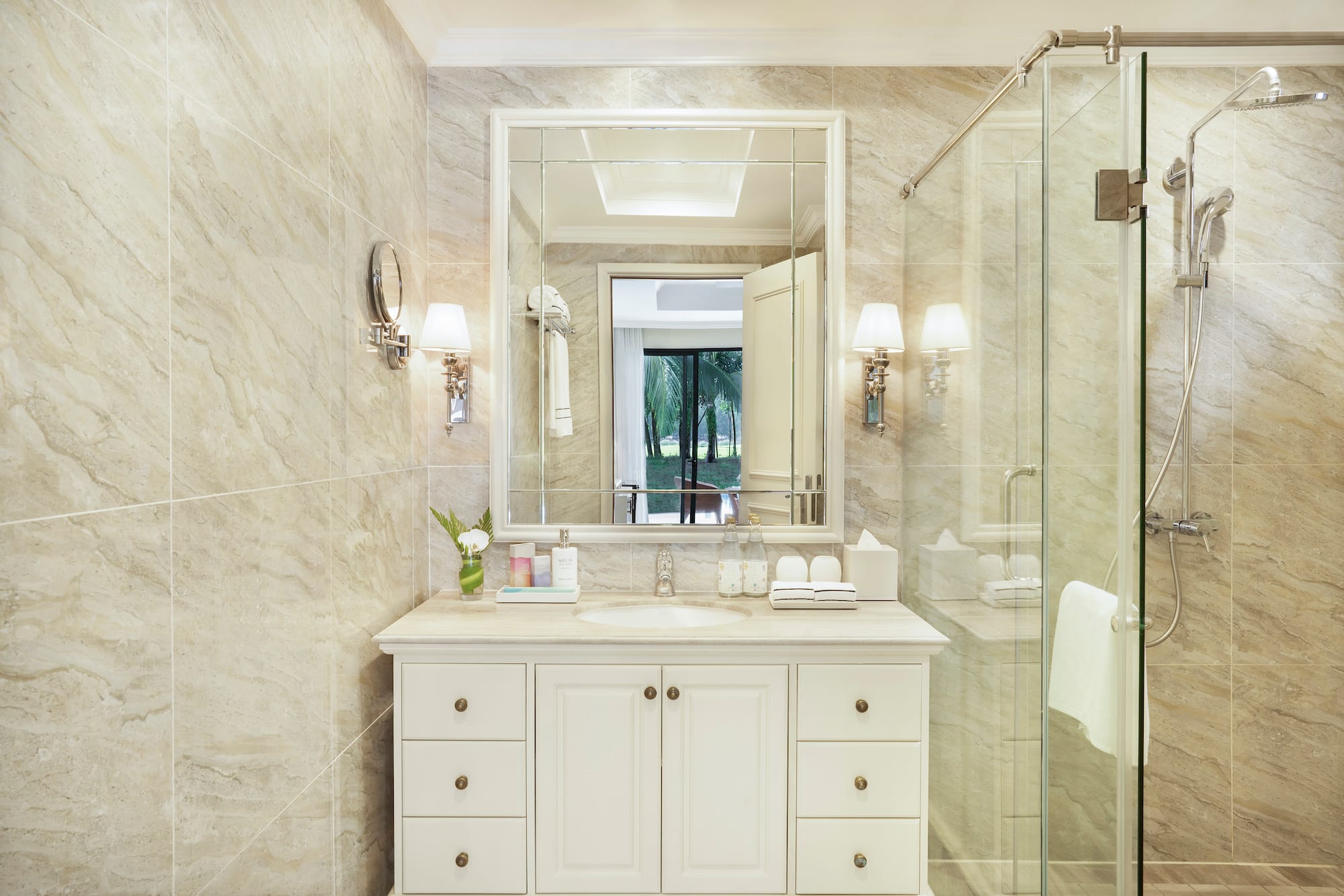 a bathroom with a mirror and a shower