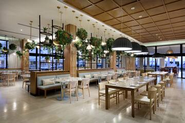 a restaurant with tables and chairs