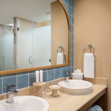 a bathroom with a mirror and sink