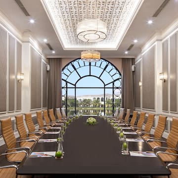 a conference room with a large table and chairs