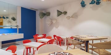 a room with tables and chairs