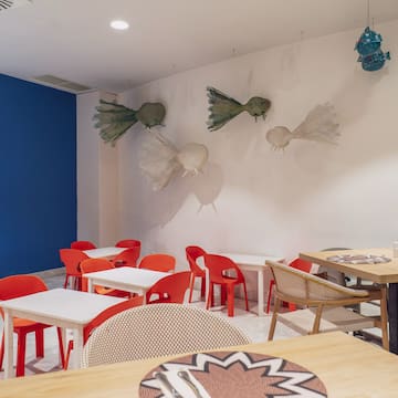 a room with tables and chairs