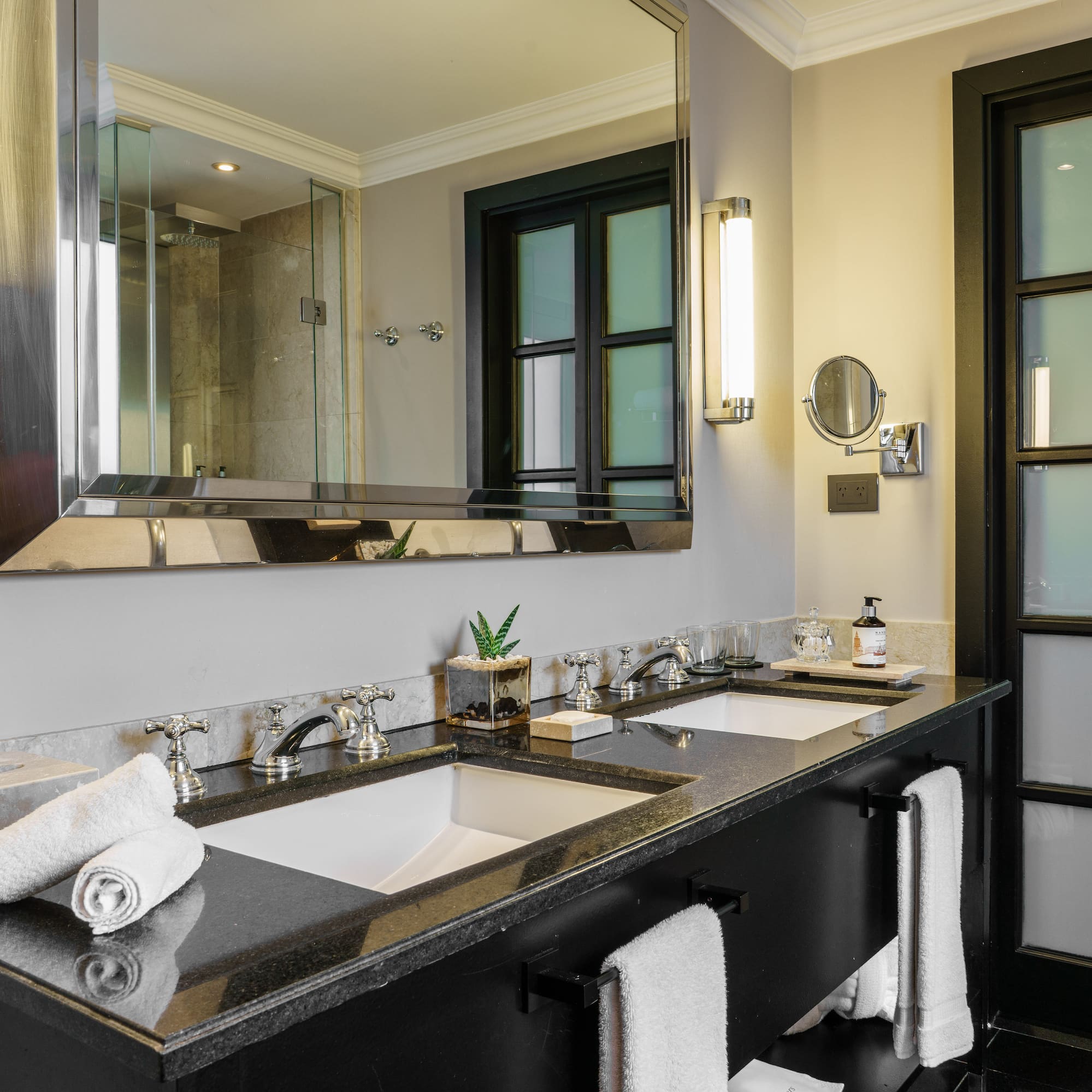 a bathroom with a large mirror and sinks