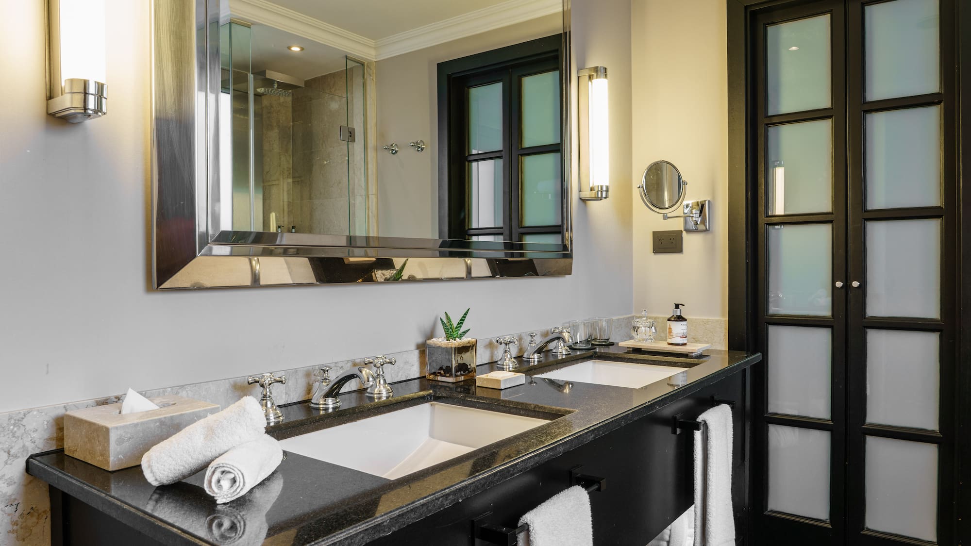 a bathroom with a large mirror and sinks