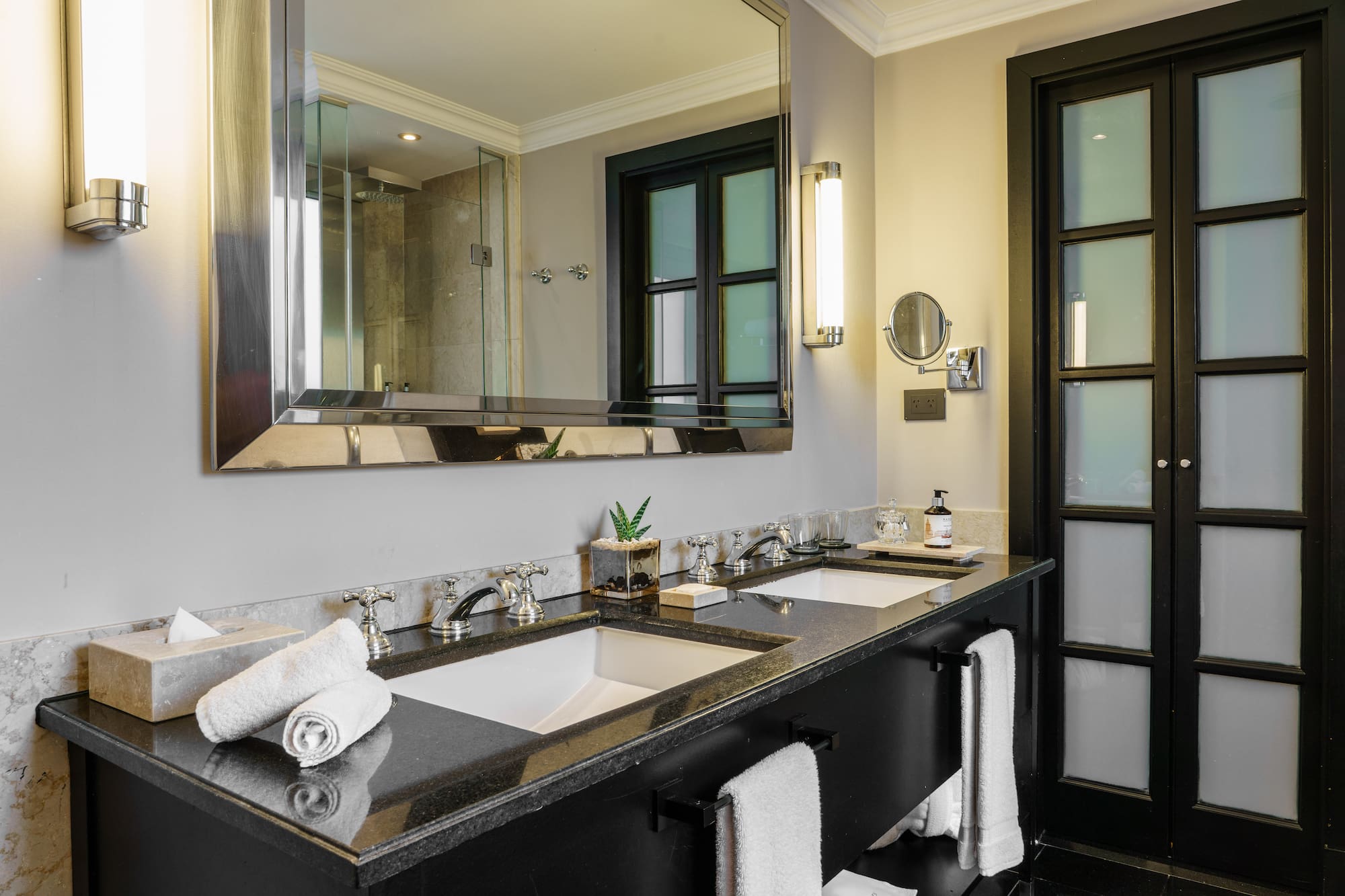 a bathroom with a large mirror and sinks