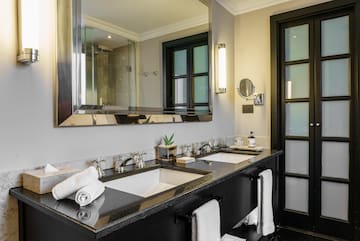 a bathroom with a large mirror and sinks