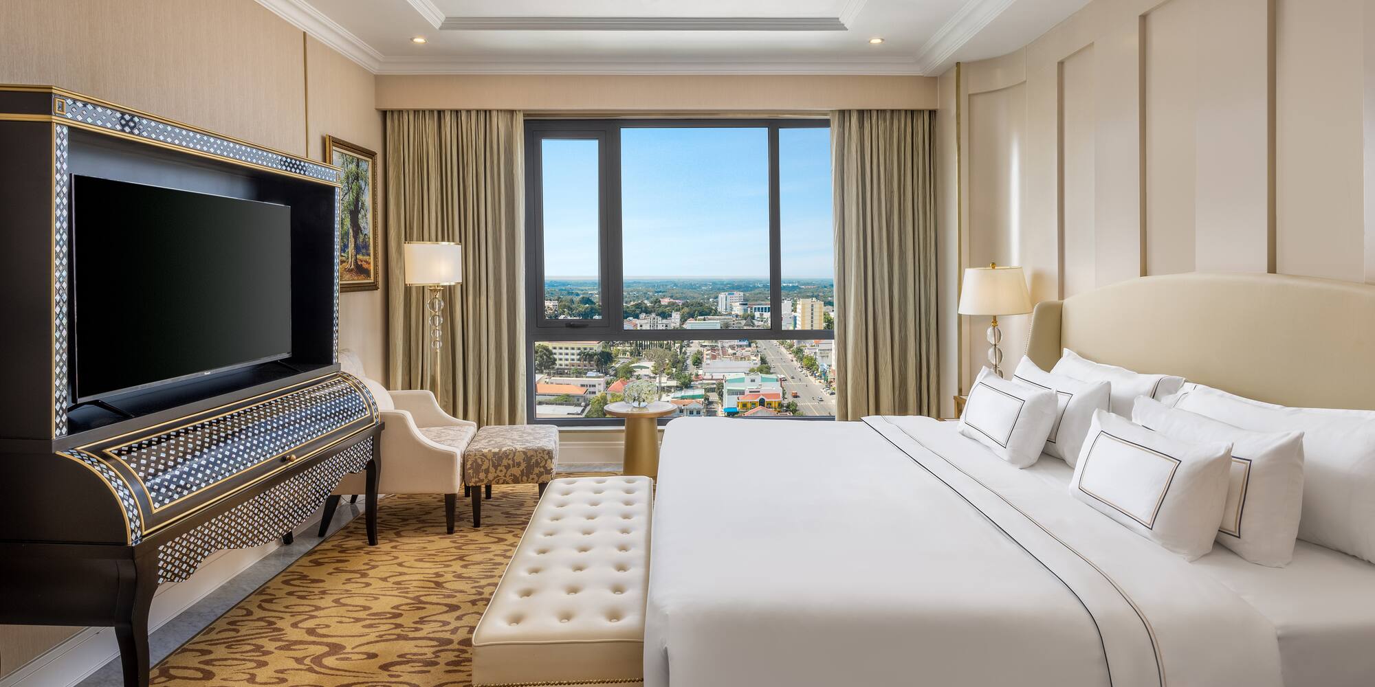 a room with a large bed and a piano