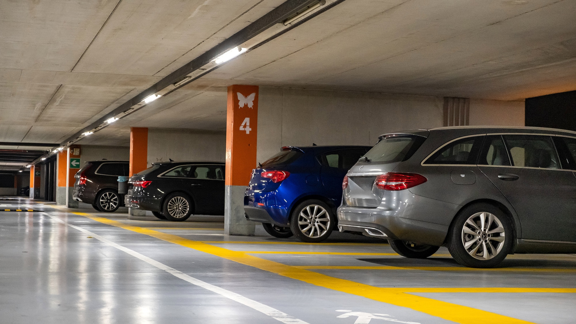 a parking garage with cars parked in it